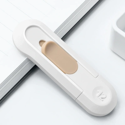 Нож канцелярский Deli NS065White шир.лез.12мм выдвижное лезвие пластик белый блистер