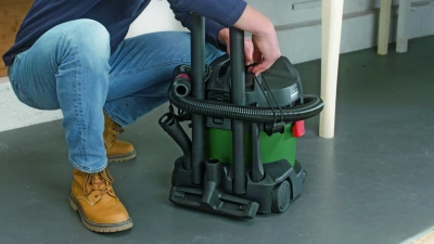 Строительный пылесос Bosch UniversalVac15 1000Вт (уборка: сухая/влажная/выдув) зеленый